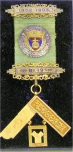 In Freemasonry, the Past Master’s Jewel is a special emblem awarded to a Mason who has served as the Master of a Lodge. It is a symbol of recognition and respect for the individual’s leadership and contributions during their term. The jewel often features the 47th Problem of Euclid, which is a geometric theorem also known as the Pythagorean Theorem, symbolizing the progress made in Freemasonry by the recipient1.