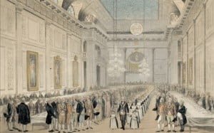 The Chevalier Ruspini leads a procession of girls from the Royal Cumberland School during a fundraising dinner, showing the interior of Sandby’s Hall