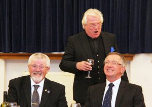 Godfrey Hirst (centre) singing the master’s toast to the obvious delight of Dave Barr (left) and John Robbie Porter