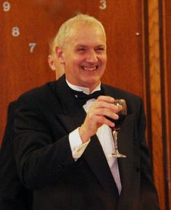 Newly installed master of the lodge Derek Ashwood takes wine with the brethren.