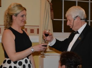 Marie (left) being toasted by Norman.