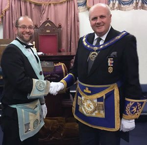 David Winder congratulates the proclaimed Worshipful Master of Wigan Lodge No 2326, Craig Lyon.