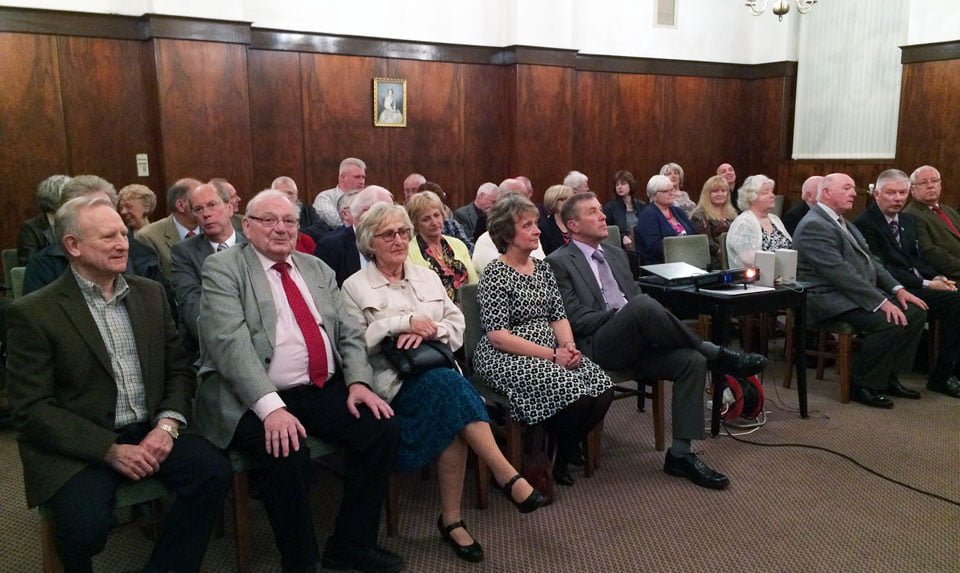 The audience listening intently.