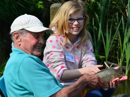 A delighted student with her first catch