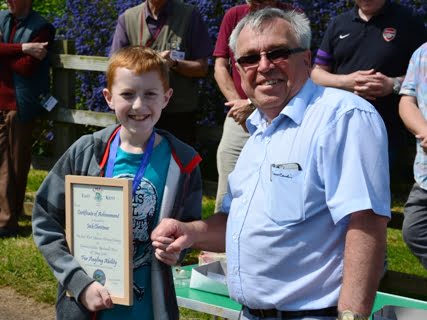 David Graeme congratulates a student on receiving his certificate