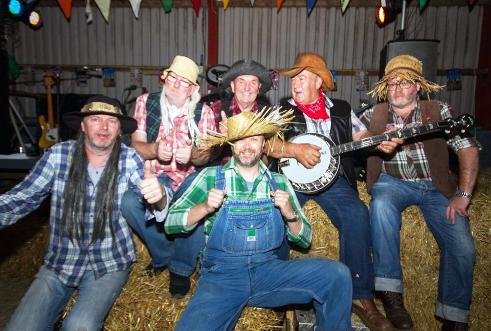 The Holborn Hillbillies with John Slone holding the banjo and Steve McKellar at the front.
