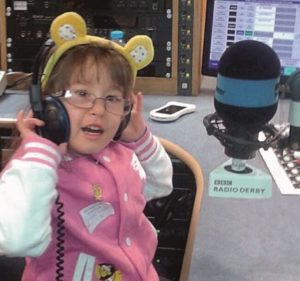 Picture of Four-year-old Isobel Walker enjoy herself on the Radio