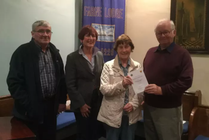 Photo Joan Turnbull, chairman, and Pat Scott, of the Seahouses Cancer Fund, with Jack Shiel and Tony Cassidy, of Farne Lodge.