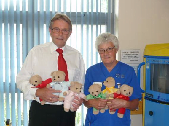 Photo of Steve Thurgood is pictured at the new Walk-In Centre with nurse Heather Willoughby and a few of the cuddly bears.