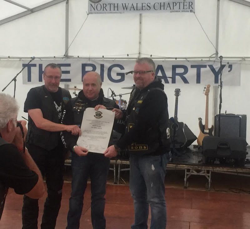 Photo of  W.Bro. Mark Butler. President (right), and W.Bro. Norman Pretswell. Vice President (left), receiving the Charter on behalf of the Cumbria Chapter of the Widows Sons Masonic Bikers Association from National President W.Bro. Peter Younger.