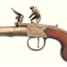 Made around 1800, the pocket sized flintlock pistol has a walnut grip with masonic details including the Volume of Sacred Law and a plumb rule